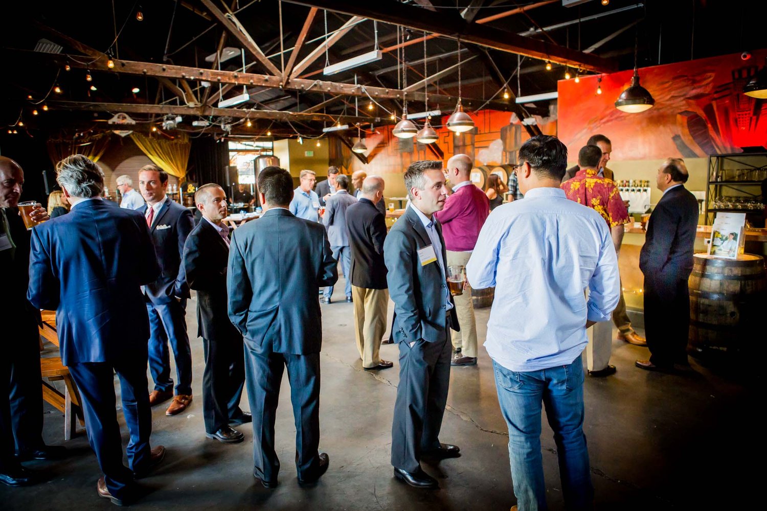 Illustrative corporate networking reception in an industrial venue