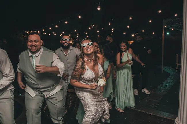 Bride and guests enjoying a lively late-night celebration